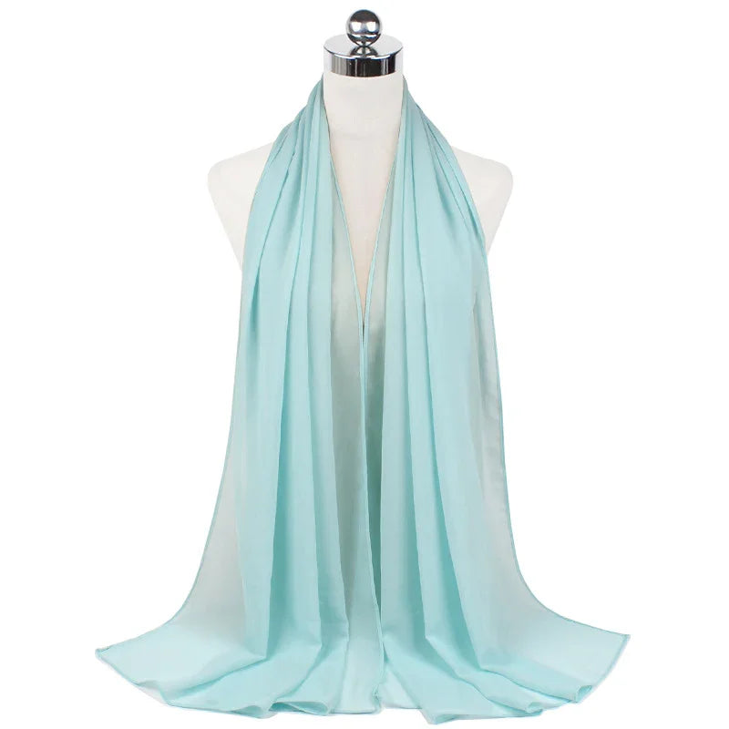 Light blue sheer chiffon scarf displayed on a white mannequin bust with silver top