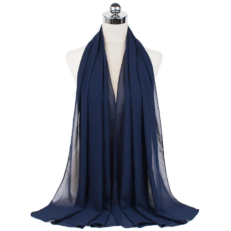 Navy blue sheer chiffon scarf displayed on white mannequin bust
