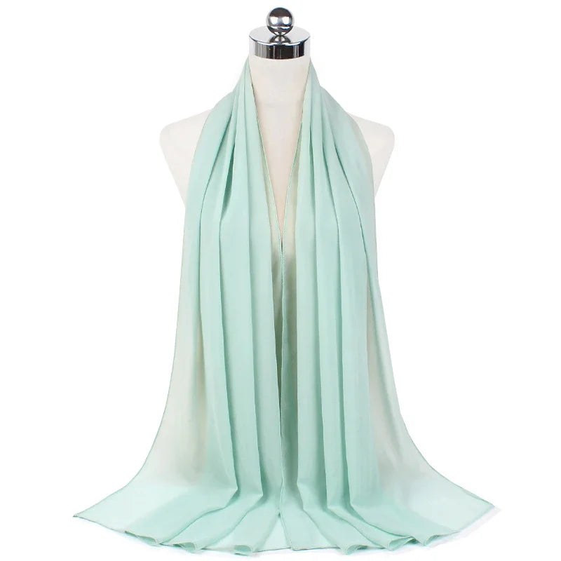 Light blue chiffon scarf displayed on a white mannequin against a white background