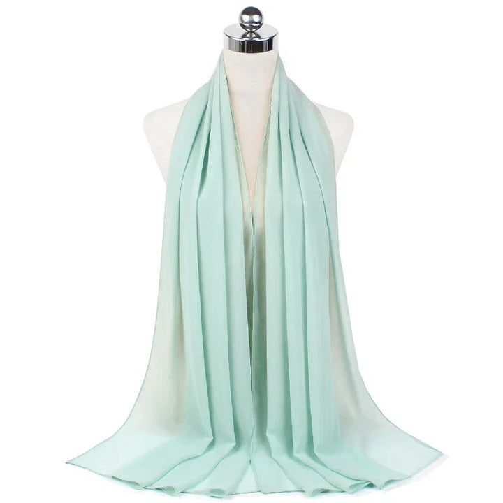 Light blue chiffon scarf displayed on a white mannequin against a white background