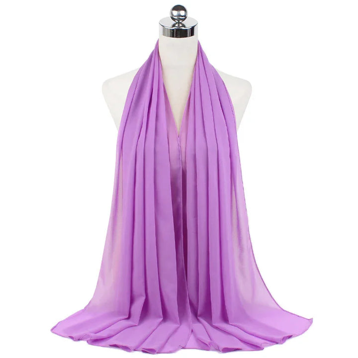 Soft lavender chiffon scarf draped on white mannequin with pleated design