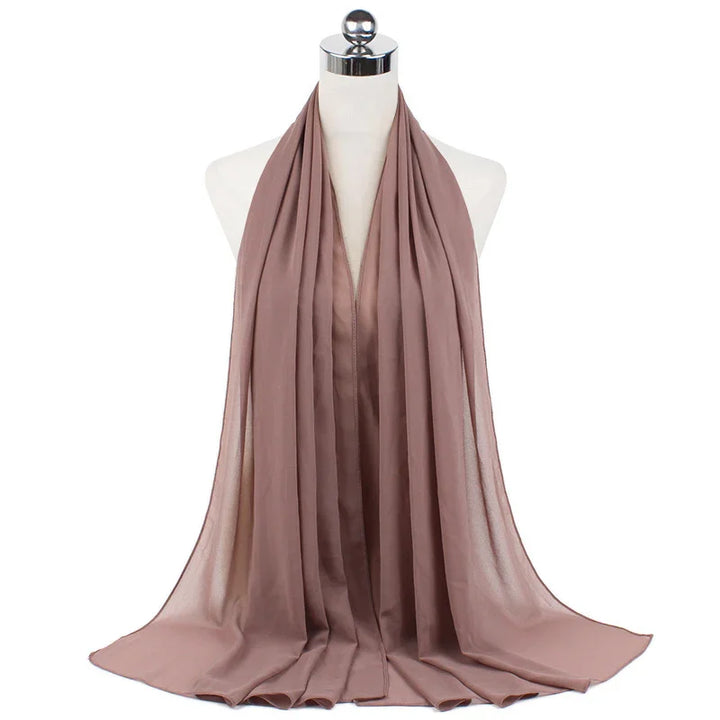mauve lightweight chiffon scarf draped on white mannequin with silver top
