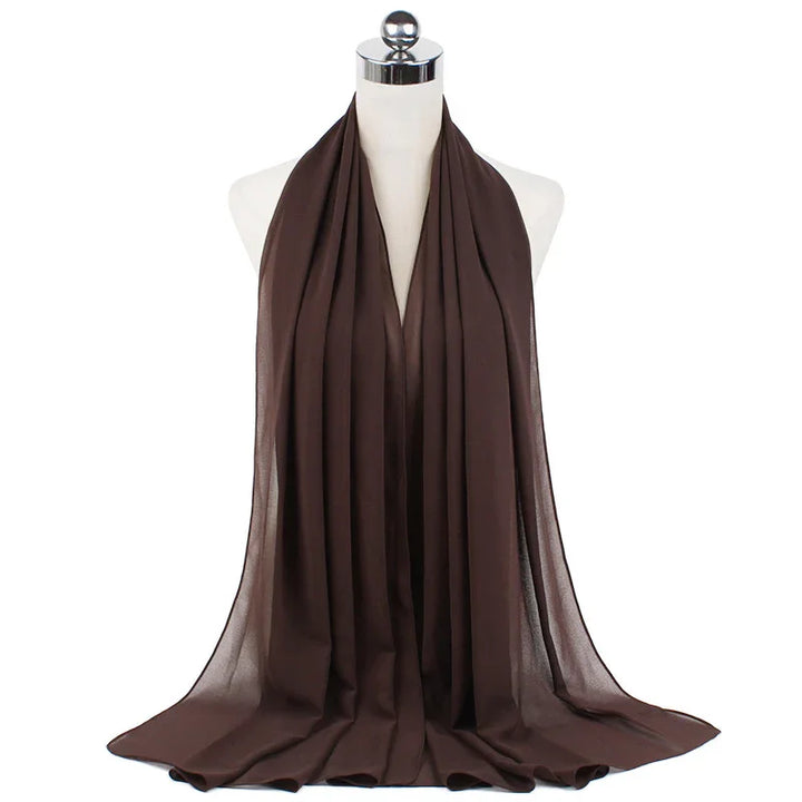 Brown lightweight chiffon scarf displayed on white mannequin with chrome top