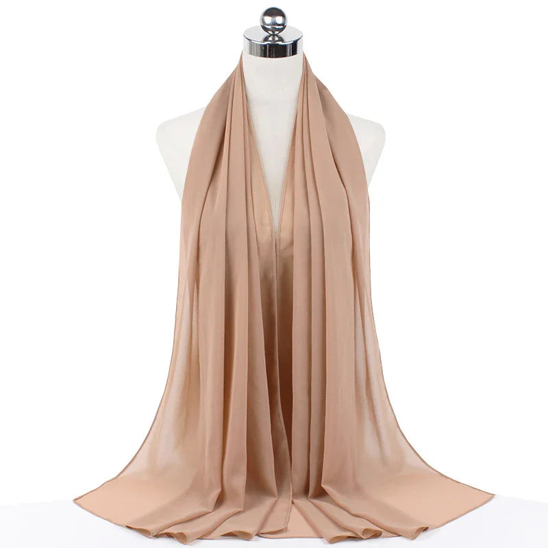 Beige lightweight chiffon scarf draped on white mannequin stand