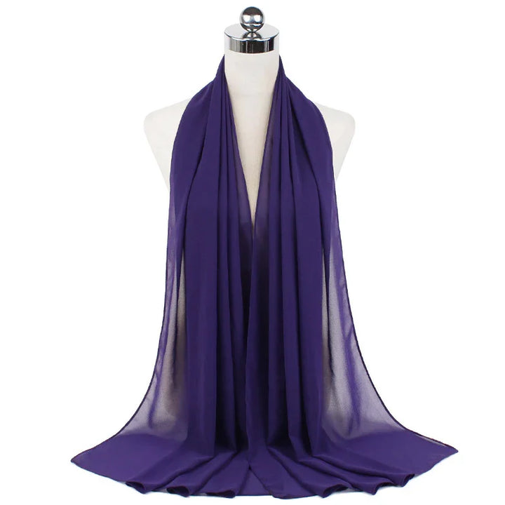Elegant purple chiffon scarf draped on white mannequin bust with silver neck cap