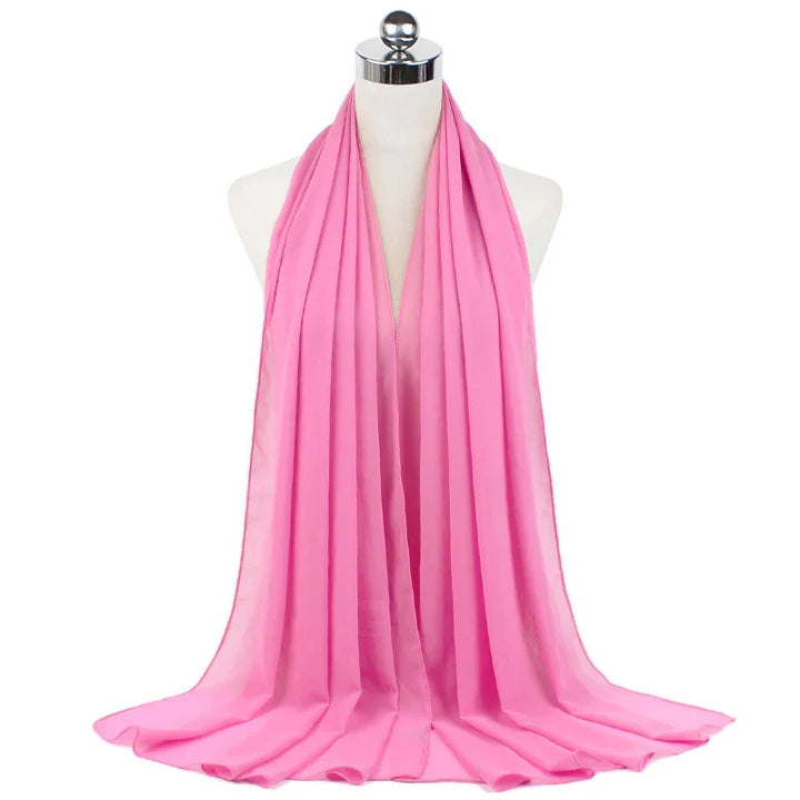 Light pink chiffon scarf draped on white mannequin with silver neck cap