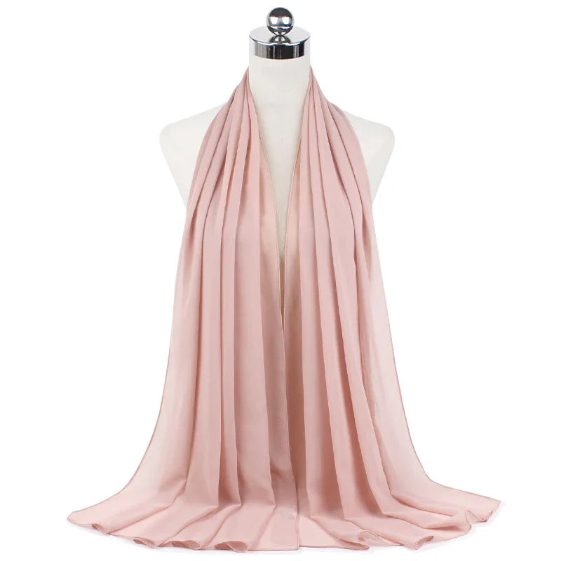 light pink pleated chiffon scarf displayed on mannequin with chrome top