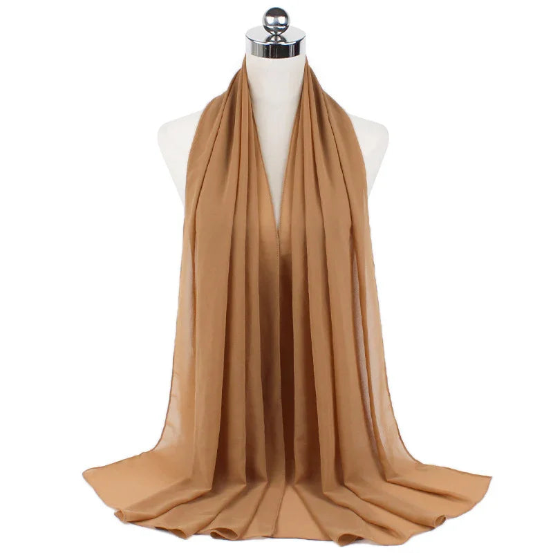 Light brown chiffon scarf displayed on white dress form with silver top, elegant lightweight fabric