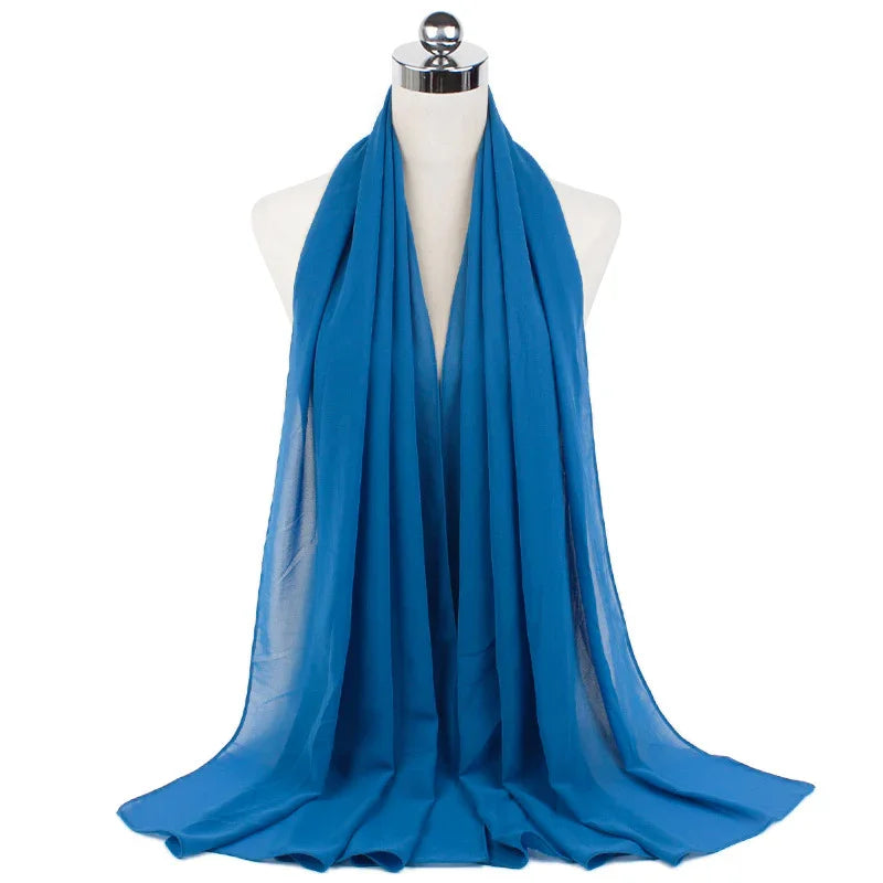 Blue lightweight chiffon scarf displayed on white mannequin with chrome neck cap
