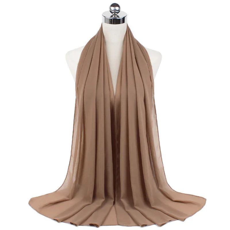 Beige lightweight chiffon scarf displayed on white mannequin bust