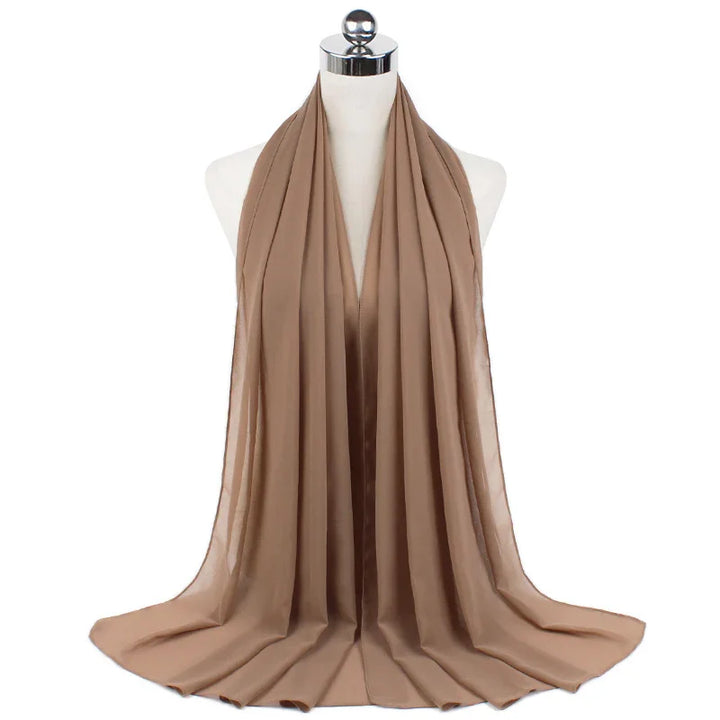 Beige lightweight chiffon scarf displayed on white mannequin bust