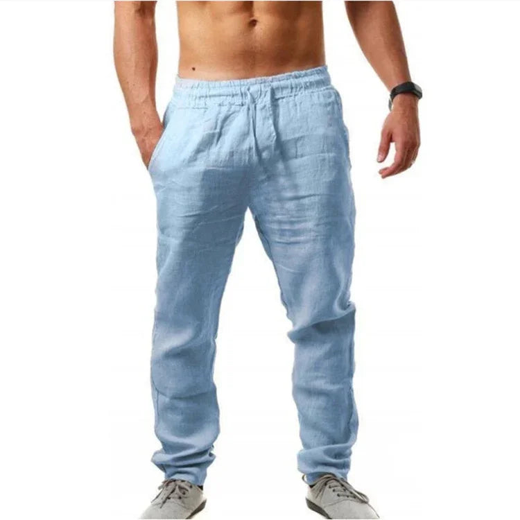 Man wearing light blue casual linen pants with elastic waist and pockets