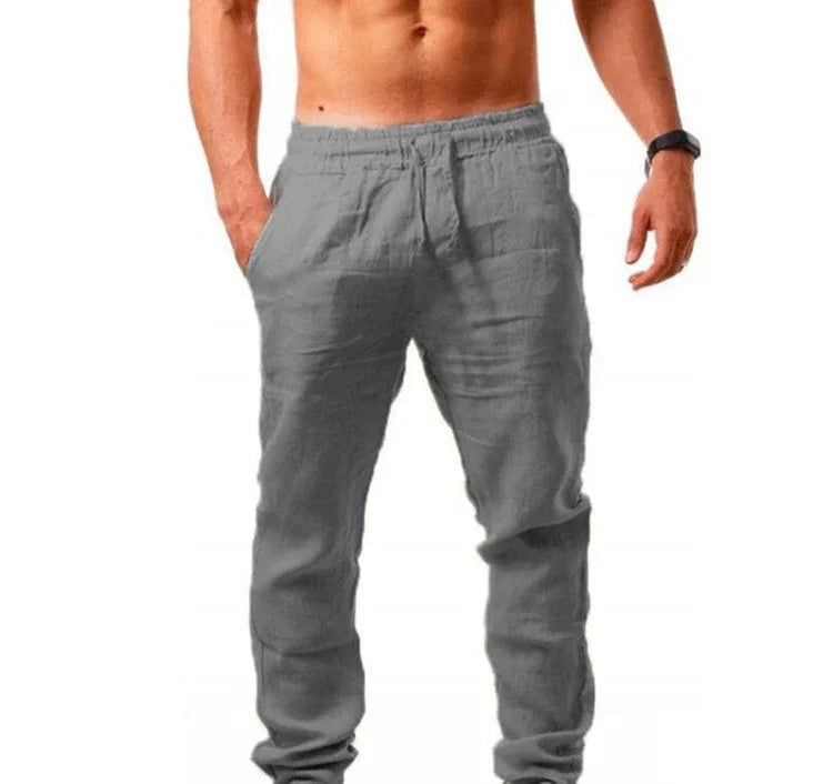 shirtless man wearing gray linen casual pants with elastic waistband and side pockets