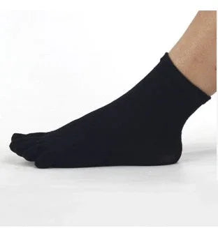 Black ankle-length toe socks worn on foot against white background