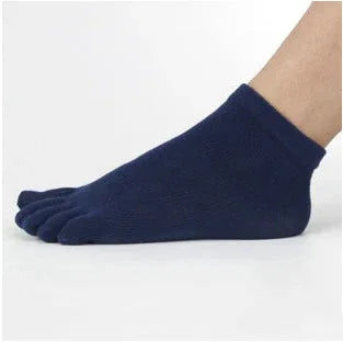 Navy blue five-toe ankle socks worn on a foot against a white background