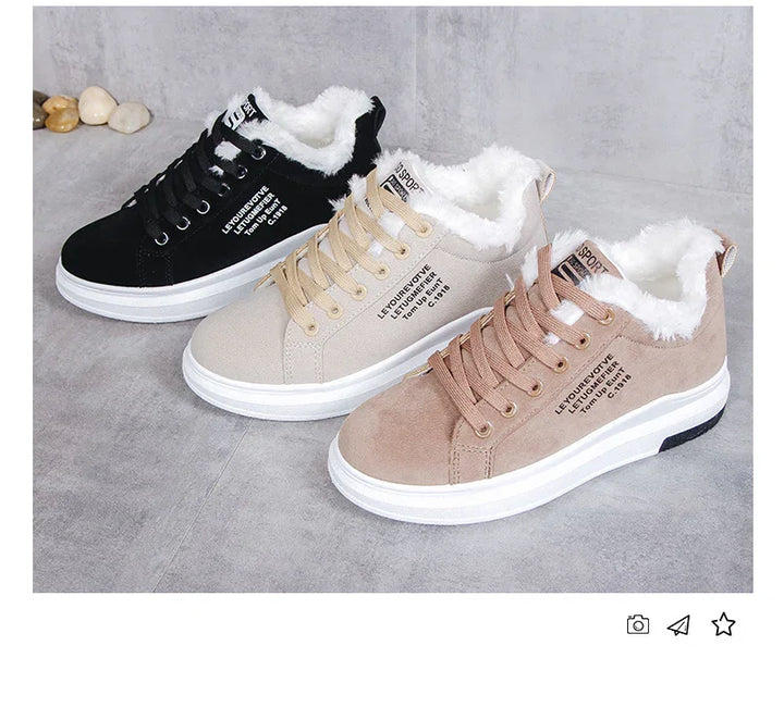 Three pairs of casual fur-lined sneakers in black, beige, and light brown on gray floor