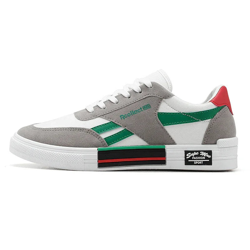 white and grey sneaker with green stripes, red heel tab, and black red striped sole detail