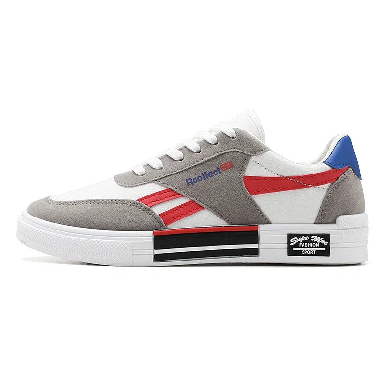 White and grey casual sneaker with red stripes, blue heel tab, and black-striped sole branding