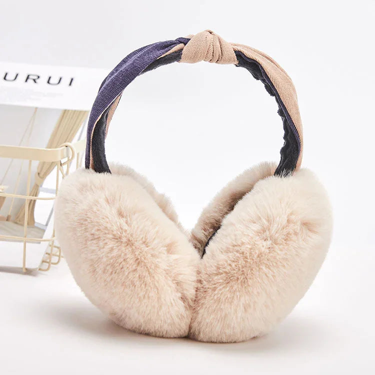 Beige fluffy earmuffs with soft plush padding and a two-tone blue and beige fabric headband