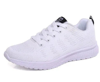 white breathable mesh running shoe with white sole and black logo on tongue