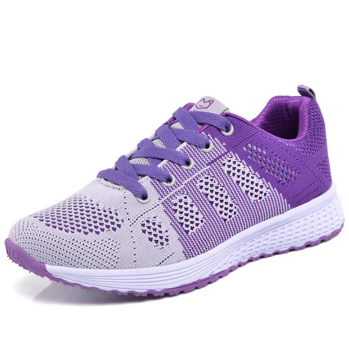 Purple and lavender breathable knit running sneaker with cushioned white sole and purple laces