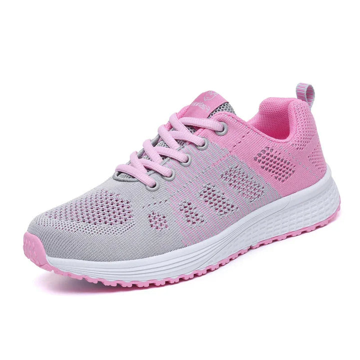 Pink and gray breathable mesh athletic sneaker with white sole and pink laces