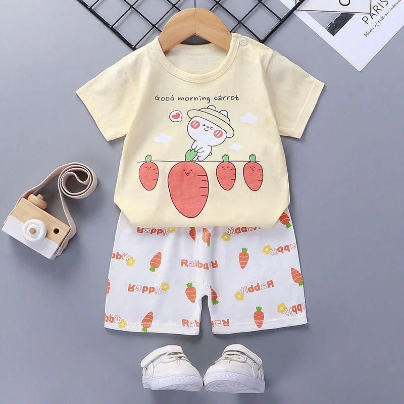 toddler outfit with yellow t-shirt featuring cartoon carrots and white shorts with carrot prints