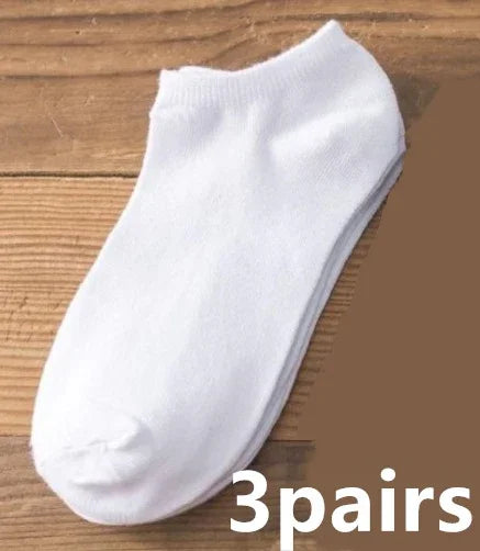White no-show ankle socks displayed on wooden surface with text '3 pairs'