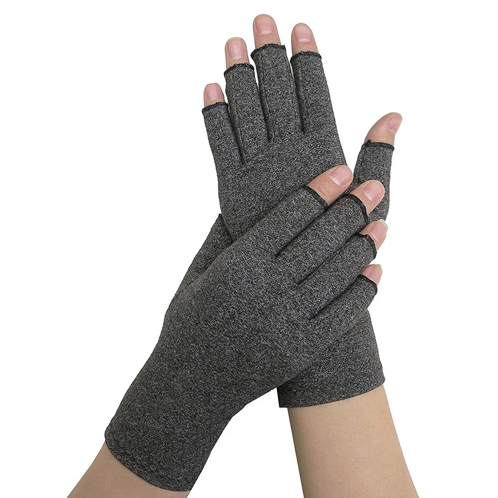 Pair of dark gray fingerless gloves worn on hands against white background