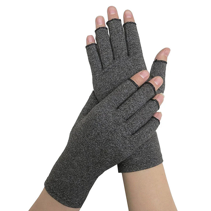Pair of dark gray fingerless gloves worn on hands against white background