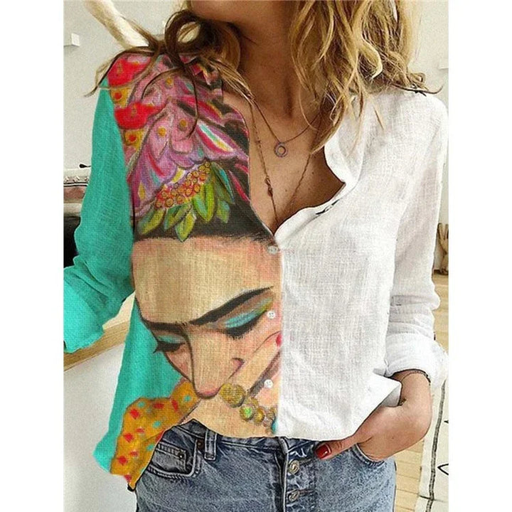 Woman wearing a long-sleeve button-up shirt with a colorful artistic portrait design on one side and solid white on the other