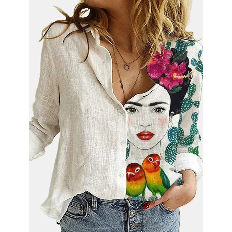 White button-up shirt with colorful Frida Kahlo face, pink flowers, cacti, and two vibrant parrots print