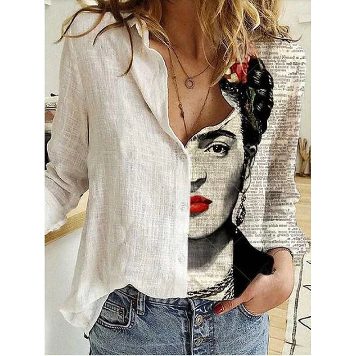 Woman wearing a unique half plain white, half Frida Kahlo portrait button-up shirt with blue jeans
