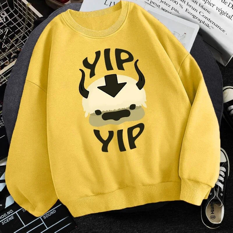 Yellow sweatshirt with cartoon Appa face and text Yip Yip inspired by Avatar series