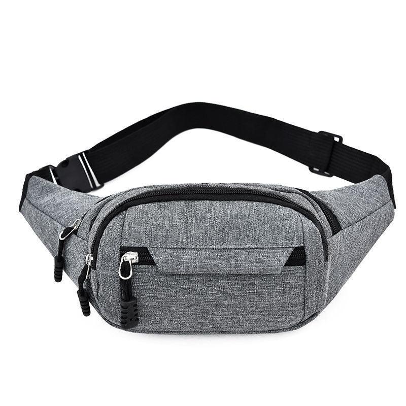 Grey fabric waist bag with multiple zippered compartments and black adjustable strap