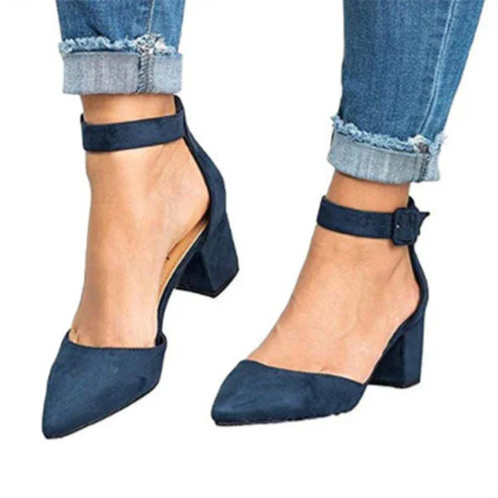 Womens navy blue suede block heel shoes with ankle straps worn with cuffed denim jeans
