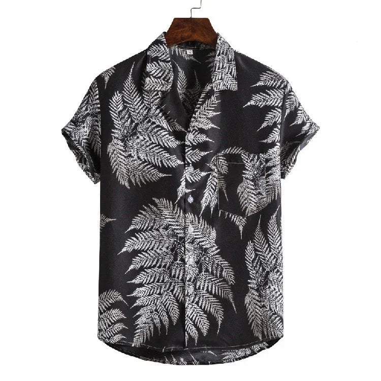 Black short-sleeve button-up shirt with white fern leaf print and chest pocket on wooden hanger