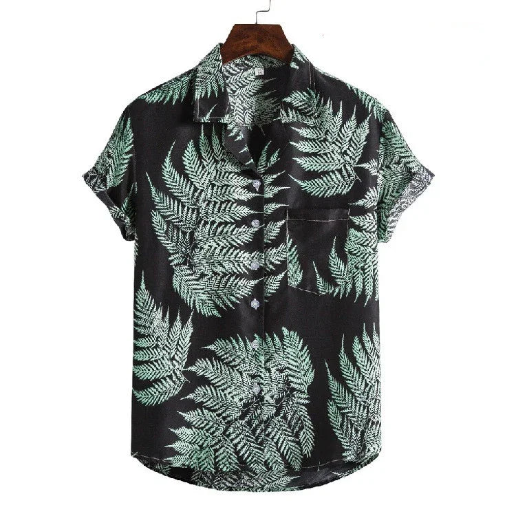 Black short-sleeve button-up shirt with green fern leaf print and front pocket on hanger