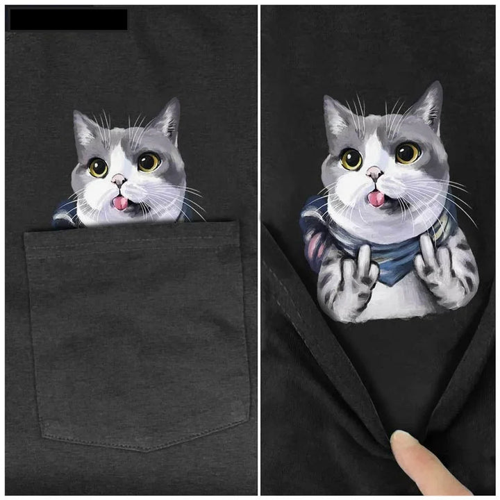 black T-shirt with a cute grey and white cat peeking from pocket, cat showing middle fingers and tongue out