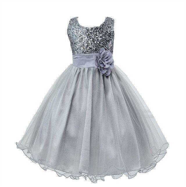 Silver sleeveless flower girl dress with sequin bodice and tulle skirt featuring a floral waistband