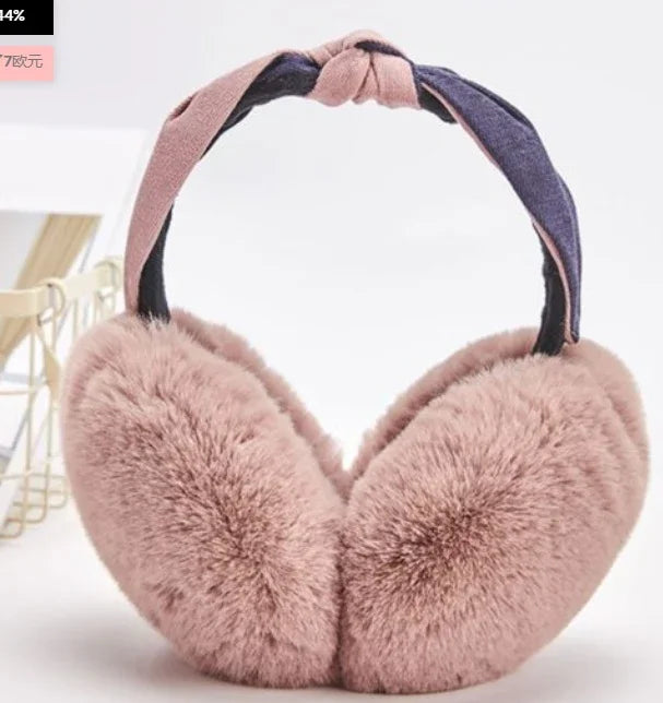 Soft pink fluffy earmuffs with a knotted fabric headband in pink and dark blue, cozy winter accessory
