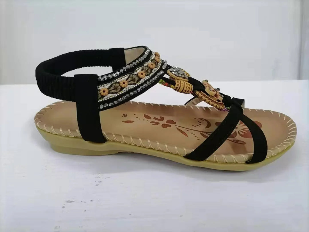 Black embroidered women's sandal with cushioned sole and floral bead detailing