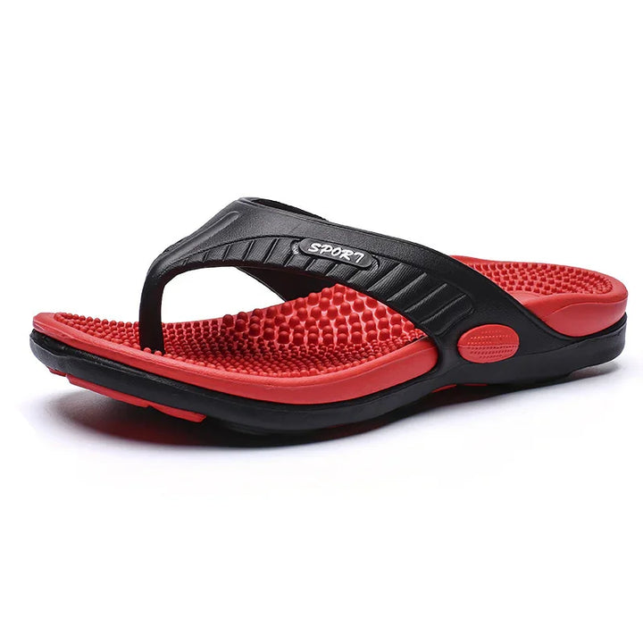 Red and black sports flip flop sandal with textured massage footbed and strap detail