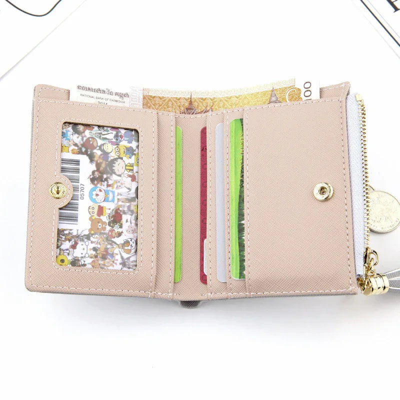 beige leather wallet with clear ID slot showing cartoon card, multiple credit card slots, and cash compartment