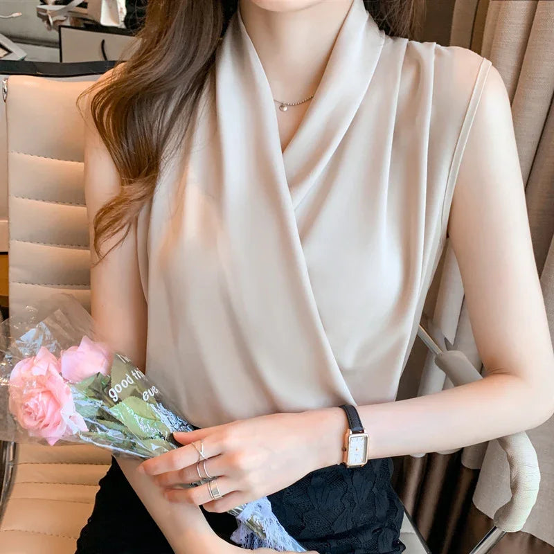 Woman in sleeveless beige blouse holding pink roses, wearing black lace skirt and wristwatch