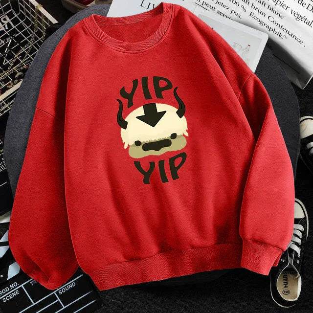 Red sweatshirt with a cartoon flying bison face and 'YIP YIP' text print