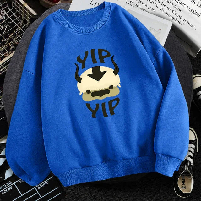 Blue sweatshirt featuring a cartoon style animal face with horns and text YIP YIP