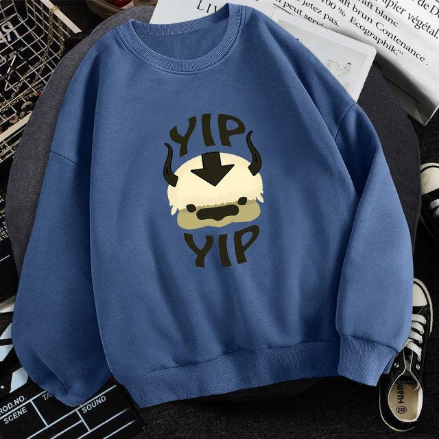 Blue sweatshirt featuring a cute cartoon bison head with horns and text 'YIP YIP' in bold letters