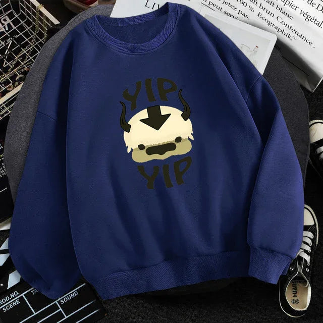 blue sweatshirt with cartoon Appa face and Yip Yip text graphic on chest