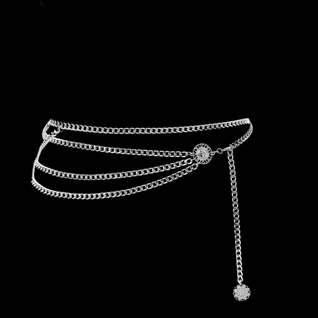 Silver layered chain belt with decorative flower charm on black background